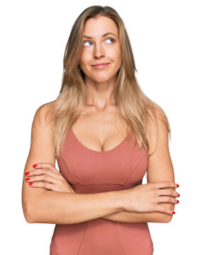 Beautiful caucasian woman wearing casual clothes smiling looking to the side and staring away thinking.