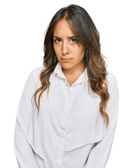 Young brunette woman wearing casual clothes skeptic and nervous, frowning upset because of problem. negative person.