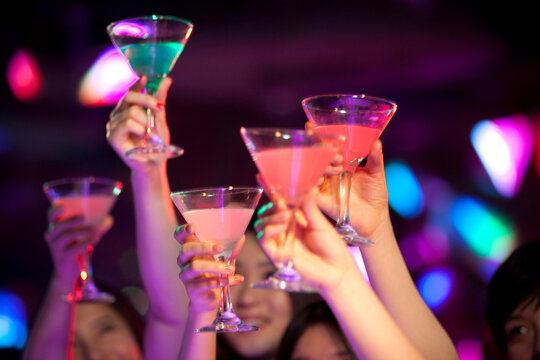 Stylish young Chinese giving a toast