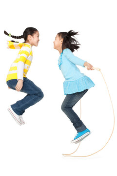 Two friends jump roping together