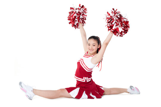 Cheerleader in action with her pom-poms