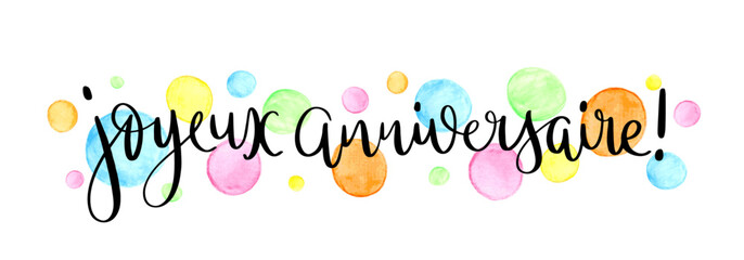 JOYEUX ANNIVERSAIRE (HAPPY BIRTHDAY in French) black vector brush calligraphy with colorful watercolor dots