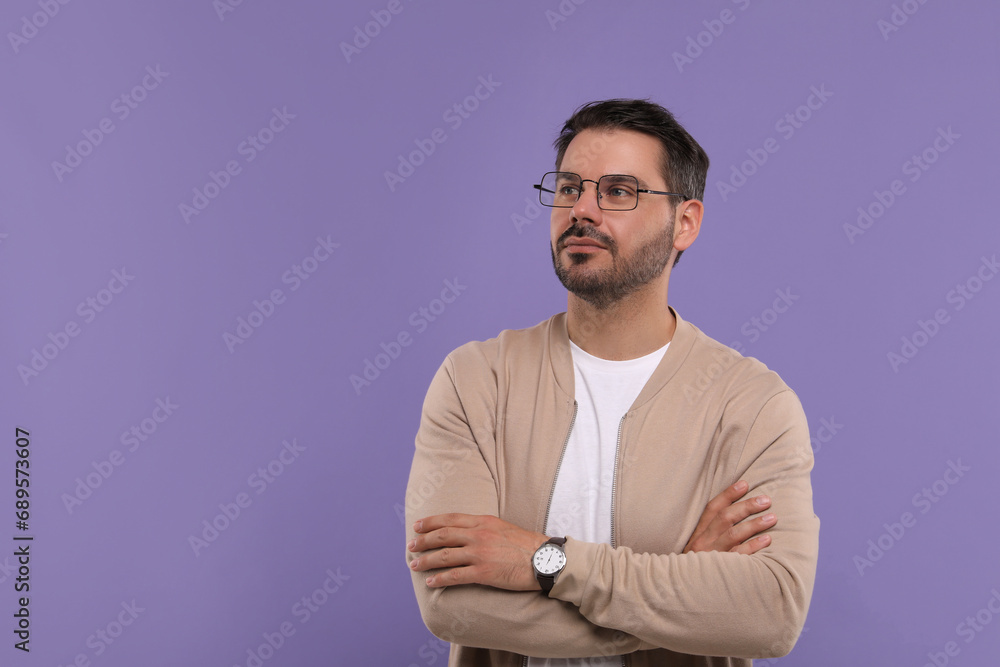 Poster Portrait of man in stylish glasses on violet background, space for text