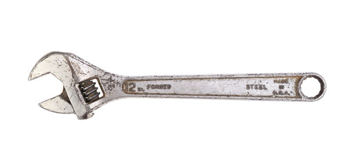 Old adjustable wrench on white background 