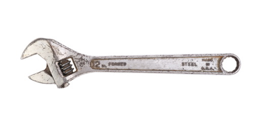 Old adjustable wrench on white background 
