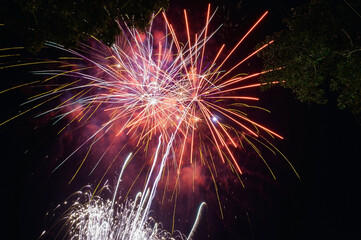 Fireworks explode in the dark sky celebrating the annual festival.