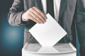 Man putting his vote into ballot box on gradient color background, closeup