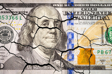 Cracked 100 dollar banknote. Destruction dollar world system. economic crisis recession.