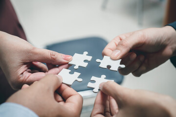 business strategy ideas Business team planning a strategic meeting Assembling jigsaw pieces, using jigsaw puzzles, showing solutions for business people, teamwork.	