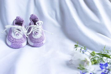 Knitted booties socks on a white background for newborns