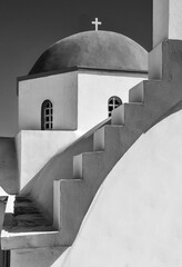 Vertical grayscale shot of the Greek Orthodox church in the Naxos village of Apollonas