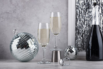 Glass of champagne with disco ball.