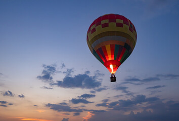 Colorful flying air balloon in sky at sunrise, sunset. Hot air balloon flying.