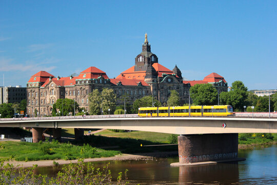 Dresden, Germany - June 3, 2023: The building of Saxon state government and Carolabruecke bridge across Elbe river