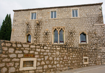 An historic stone building on the waterfront of Bol town on Brac Island, Croatia