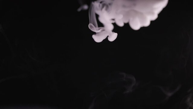 Liquid Cold Smoke fall through black background 4K