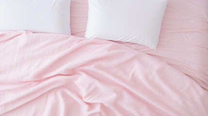 Bedding with a pink pillow and knitted plaid. Copy space