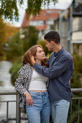 Fototapeta premium Warm Embrace of Teen Love in the Autumn Park. Capturing Teen Moments: Love Blossoms in Autumn's Embrace. Teenagers in Love: Embracing the Autumn Vibe