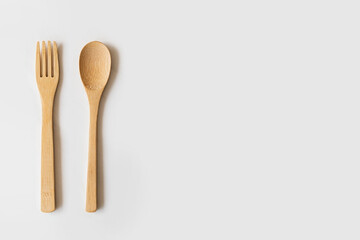 fork and spoon on white background vertical view 
