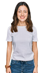 Obraz premium Young beautiful woman wearing casual white t shirt with a happy and cool smile on face. lucky person.