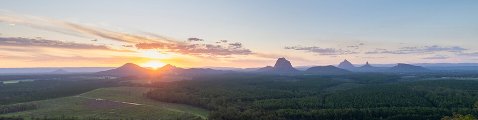 Tourists visit the Wildhorse scenic lookout for sunset panoramic views across the Glasshouse Mountains and the Sunshine Coast in Queensland
