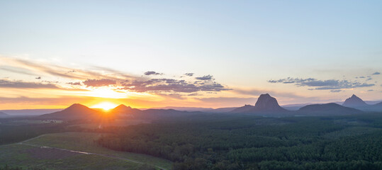 Tourists visit the Wildhorse scenic lookout for sunset panoramic views across the Glasshouse Mountains and the Sunshine Coast in Queensland