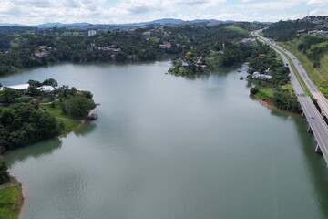 Aerial view of the Dom Pedro Highway at the height of the city of Igarata, and beside Igarata Dam.