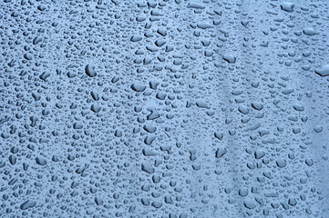 Raindrops water sticking to the car body selective focus