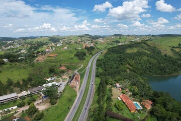 Aerial view of the Dom Pedro Highway at the height of the city of Igarata, and beside Igarata Dam.