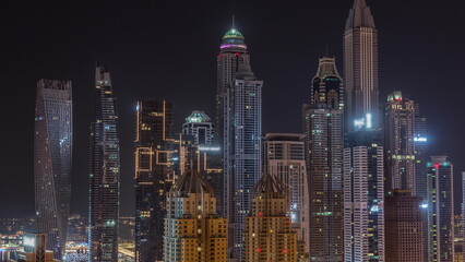 Skyscrapers of Dubai Marina near Sheikh Zayed Road with highest residential buildings all night...