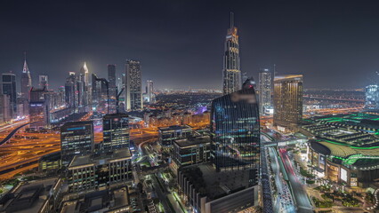 Naklejka na ściany i meble Panorama showing futuristic Dubai Downtown and finansial district skyline aerial night timelapse.