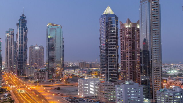 Business Bay District Skyline With Modern Architecture Night To Day Timelapse From Above.