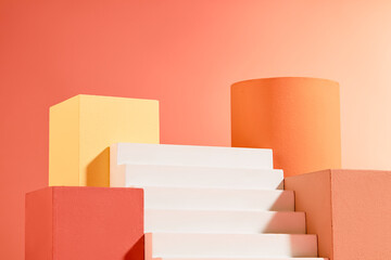 Colorful podium in different shapes and colors arranged with a white staircase. Geometric shapes...