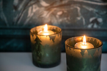 burning Christmas candles and bokeh light