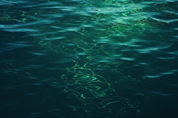 Fototapeta na wymiar Blue green water surface, Night, Small waves, Ripples - Background