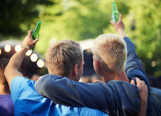 Back, toast and friends drinking beer at a music festival outdoor for a party, event or...