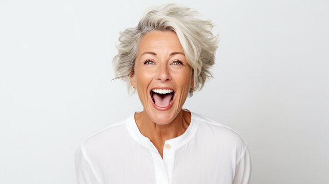 old woman celebrating looks and smiles on a white background