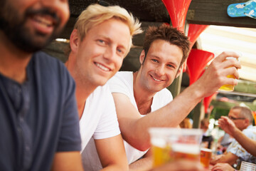 Happy man, friends and drinking at music festival, cafe or event for summer party or DJ concert....