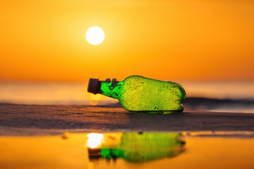 Sea sunrise and alcohol bottle on the beach sand, travel destination and exotic tropical island