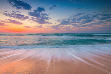 Beautiful sunrise over the sea and tropical sandy beach  - obrazy, fototapety, plakaty