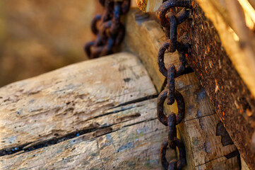 Detail of a rustic agricultural cart with a rusty chain, Cofino, Spain