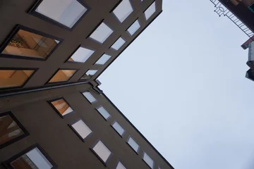 Wandcirkels aluminium Low angle view of buildings against sky © niklas storm