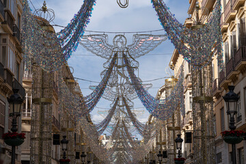 The streets of Malaga, Spain, beautifully adorned with festive Christmas decorations, capturing the...