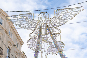 The streets of Malaga, Spain, beautifully adorned with festive Christmas decorations, capturing the...
