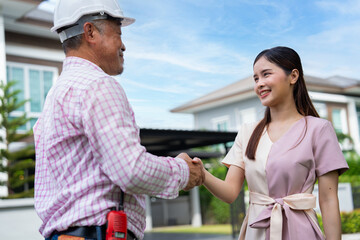 Happy homeowner stand in front of contractor and shake hand, handyman holding clipboard and after...