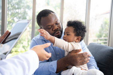 Pediatrics doctor with stethoscope for lungs or chest checkup for examining cute little girl in...