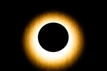 A round wall lamp was shining like a solar eclipse.