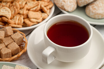 A cup of tea with sweets on the table. Sweet breakfast