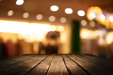 Empty wooden tabletop with blurred abstract bokeh cafe background. For product display or key...