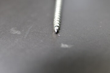 wood screw with black background macro